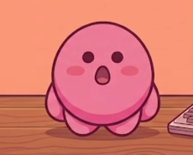 xirby standing on a wooden desk